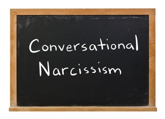 Obraz premium Conversational Narcissism written in white chalk on a black chalkboard isolated on white