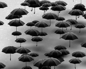 Fototapeta na wymiar group of umbrellas on pavement