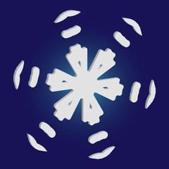 Christmas paper snowflake on blue background.