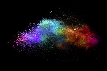 Explosion of colored powder isolated on black background. Abstract colored background. holi...