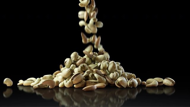 Mixed Nuts Falling on Black Glossy Floor. Almonds, Cashews and Pistachios Forming a Pile on Black Background. Healthy Diet Superfood.