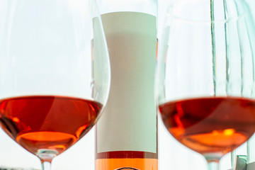 Refreshing pink rose wine in a glass. Space to write.