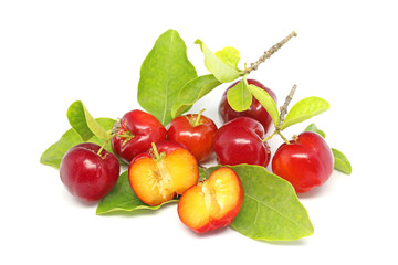 Fresh acerola fruit and slice isolated on white