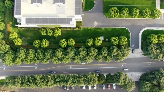 Aerial top view of city road with small traffic in business and finance district with new office building. Irvine California. USA