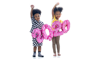 Happy African boy and girl, dark skinned kids with numbers balloon 2020 on white background, happy new year 2020, with clipping path