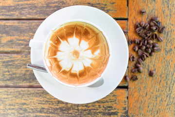 hot coffee on table / hot cappuccino with nice pattern milk foam