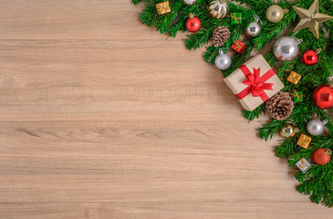 Christmas fir tree with decoration on wooden board