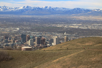 Hikers enjoy view of the snowcapped Oquirrh mountains on the foothills of the Wasatch range near Salt Lake City