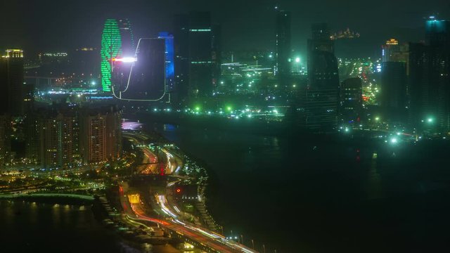Macau &ndash; Zhuhai border earial cityscape night timelapse pan up