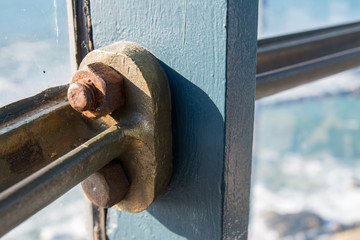 Old vintage steampunk bolts and nuts railing.