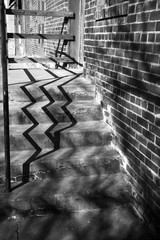 shadows falling along stairs in black and white