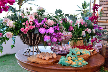 flowers in a basket sweets,  chocolate truffles, brigadeiro, chocolate sprinkles, chocolate candy,candy store,  condensed milk candy balls, candy balls , natural flowers