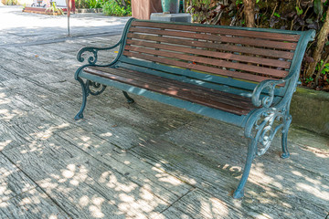 Green Metal and brown wood bench