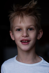 Portrait of a charming boy with changing teeth