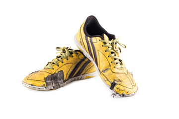Old yellow futsal sports shoes and the insole is damaged  on white background football sportware object isolated - Powered by Adobe