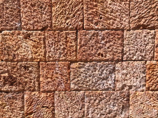 Pattern of decorative red stone wall background.Stone wall texture. random size stone wall.Background of stone wall.