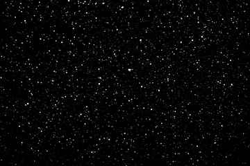 Chaotic white star bokeh on a isolated black background. falling blurry bokeh snow overlay, starry sky. white spots on black background, white drops and spots. abstraction.