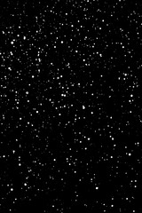 Chaotic white star bokeh on a isolated black background. falling blurry bokeh snow overlay, starry sky. white spots on black background, white drops and spots. abstraction.