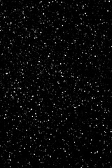 Chaotic white star bokeh on a isolated black background. falling blurry bokeh snow overlay, starry sky. white spots on black background, white drops and spots. abstraction.