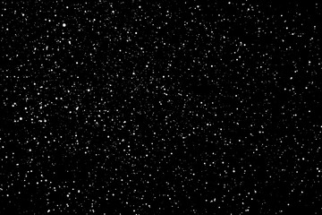Chaotic white star bokeh on a isolated black background. falling blurry bokeh snow overlay, starry sky. white spots on black background, white drops and spots. abstraction.
