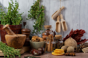 Winter autumn  different ingredients for a warming hot tea  white wood background, copy space, top view
