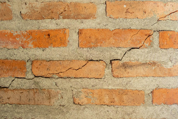 Broken bricks wall close up texture background.