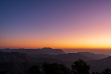 beautiful blue sky high peak mountains mist fog wildlife green forest at Khao Koh, Phu Tub Berk, Phetchabun, Thailand  guiding idea long weekend for backpacker camping campfire relaxing hiking