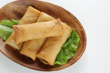 Chinese food, spring roll on wooden plate