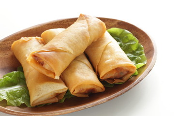 Chinese food, spring roll on wooden plate
