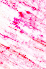 Pomegranate juice on a plastic board as an abstract background