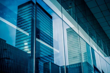 Foto op Plexiglas Reflection of architecture on modern office building © hallojulie