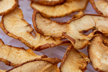 Homemade dried apples. Close-up. Selective focus. Concept: homework, supplies, conservation.