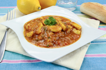squid in tomato sauce on a plate