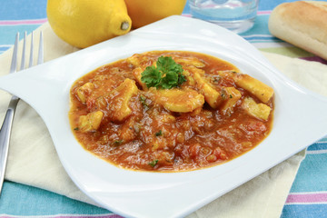 squid in tomato sauce on a plate
