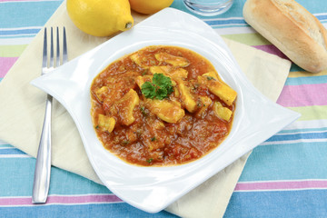 squid in tomato sauce on a plate