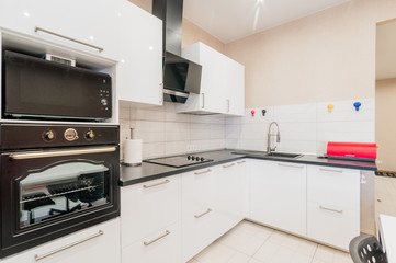 Russia, Moscow- August 05, 2019: interior room apartment modern bright cozy atmosphere. general cleaning, home decoration, preparation of the house for sale. modern kitchen, dining area