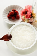 Fototapeta na wymiar Japanese food, marinated plum Umeboshi and rice porridge