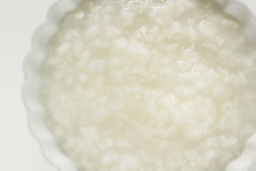 Chinese food, rice porridge in white bowl with copy space for healthy breakfast