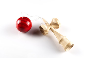 Kendama japanese wooden toy on isolated on white. Wood toy with red bal.
