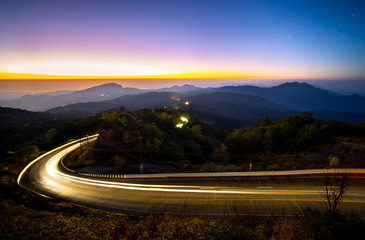 Landscape Doi Inthanon National park before the sunrise and light trail from cars at Chiang Mai Province, Thailand