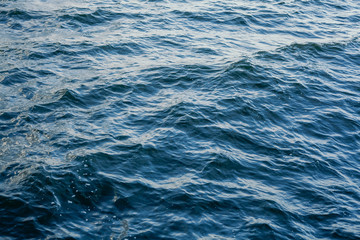 Waves on transparent water surface