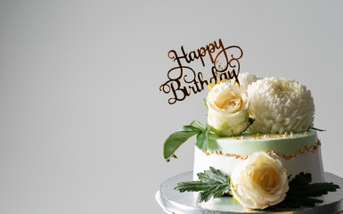 bouquet of roses on birthday cake