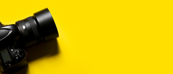 dslr photography camera isolated on yellow background. ds.r camera concept