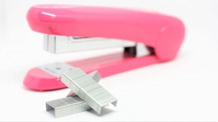 Pink stapler isolated on white background the tool for study and business