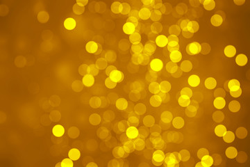 Bokeh golden light and blackish brown background, blurred background.                               