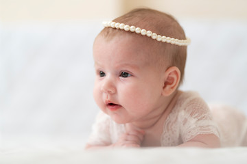 A baby Girl In Beautiful Lingerie In The Bedroom