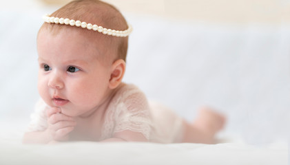A baby Girl In Beautiful Lingerie In The Bedroom