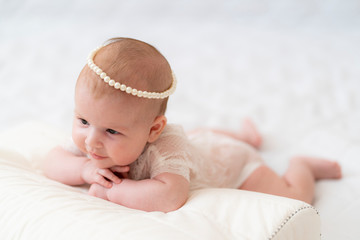 A baby Girl In Beautiful Lingerie In The Bedroom