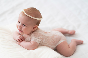 A baby Girl In Beautiful Lingerie In The Bedroom