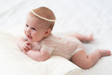 A baby Girl In Beautiful Lingerie In The Bedroom